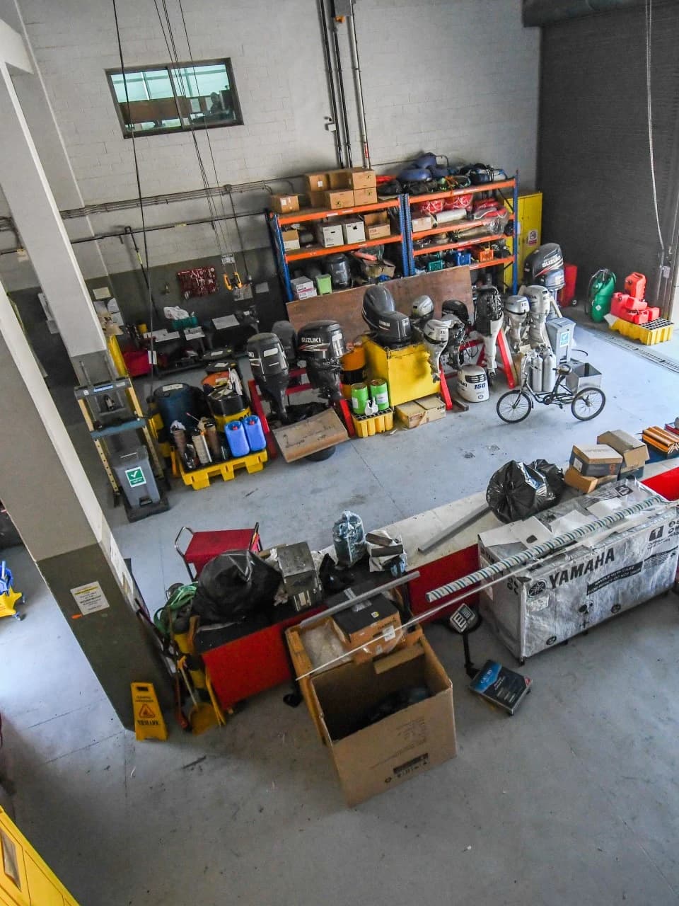 Coastline marine maintenance workshop with tools and parts.